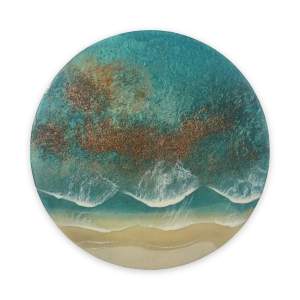 Round resin artwork depicting turquoise ocean waves breaking onto a sandy beach, with shimmering copper and teal tones creating depth and movement throughout the sea.